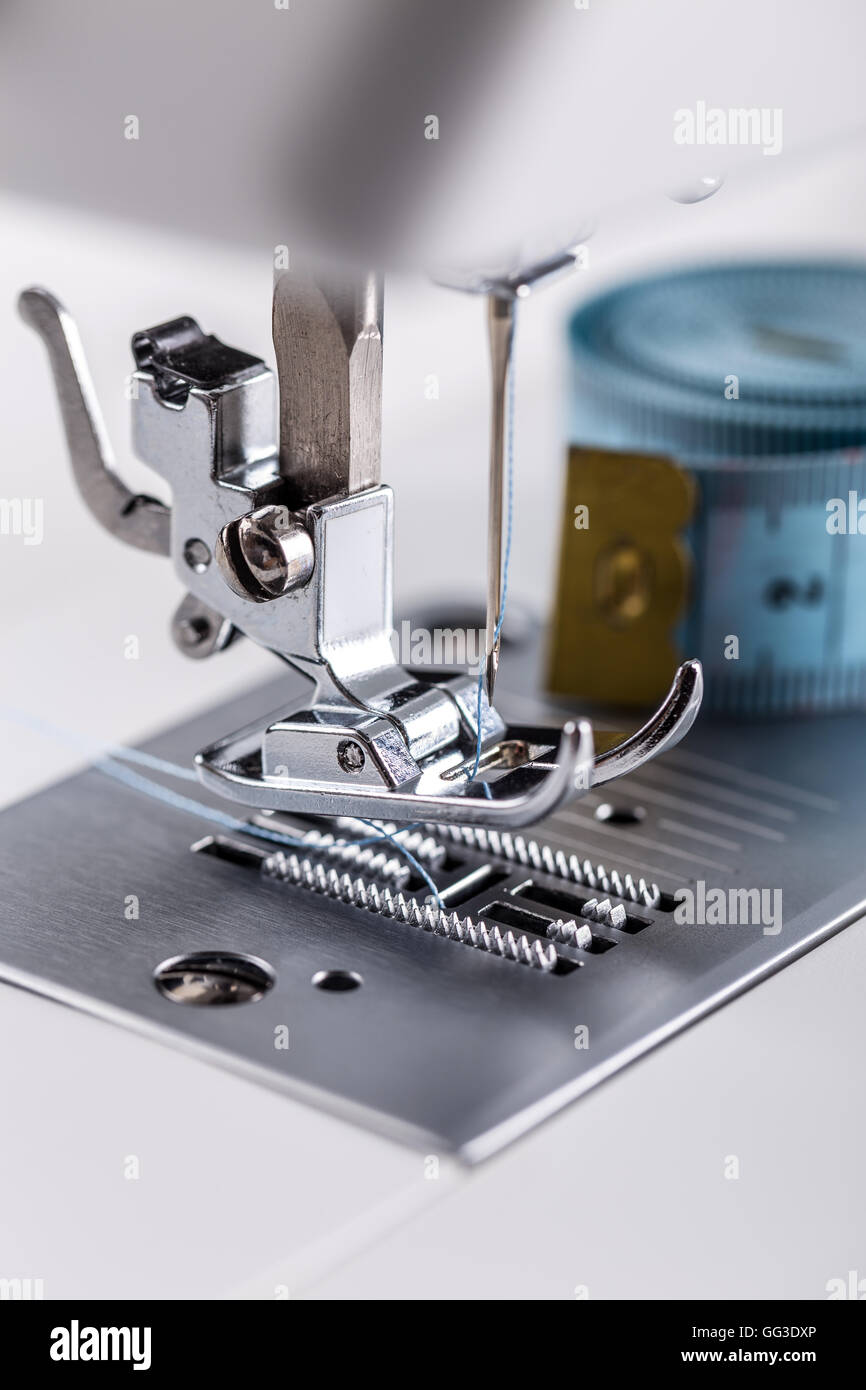 Background Of Close Up Sewing Machine Parts And Tools As Follows Needle,  Presser Foot, Threads, Bobbin, Replace Buttons On Jean Fabric. Stock Photo,  Picture and Royalty Free Image. Image 83813242.