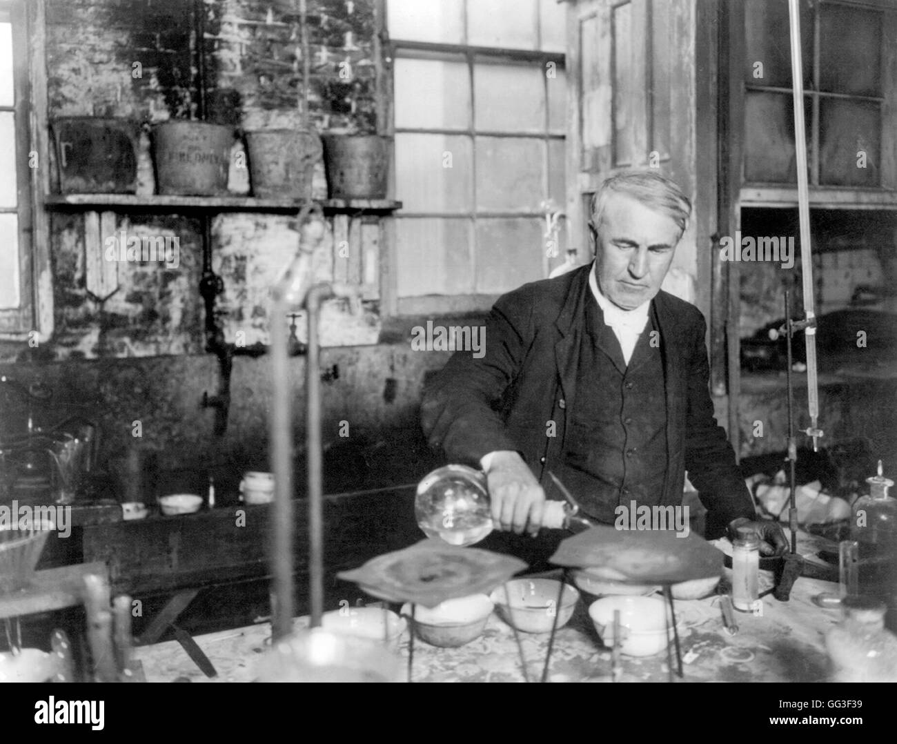 Thomas Edison. The American inventor and businessman,Thomas Edison (1847-1931), working in his chemistry laboratory. Portrait c.1905. Stock Photo