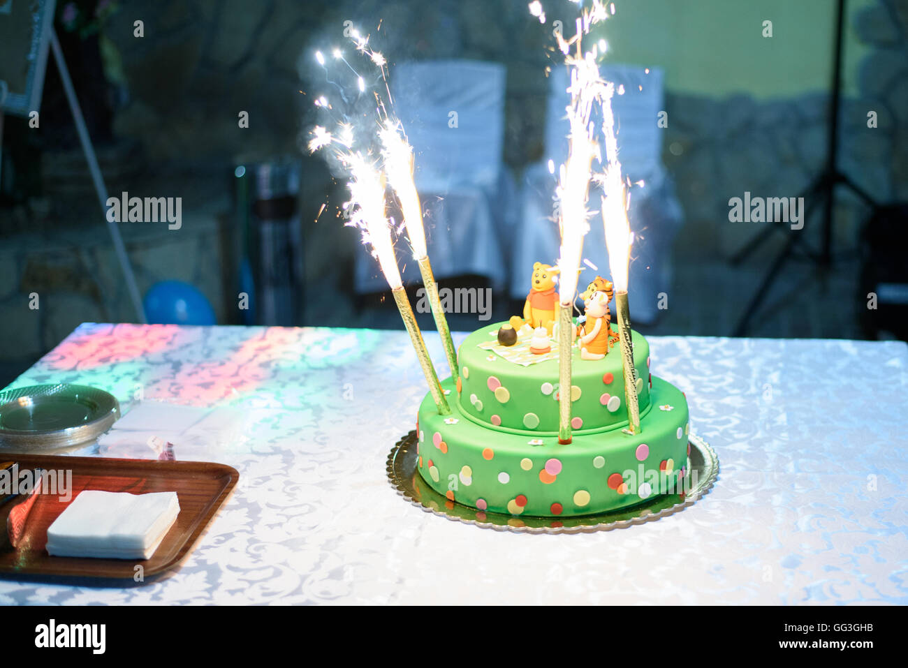 Birthday cake with candles and Winnie the Pooh by Disney Stock Photo