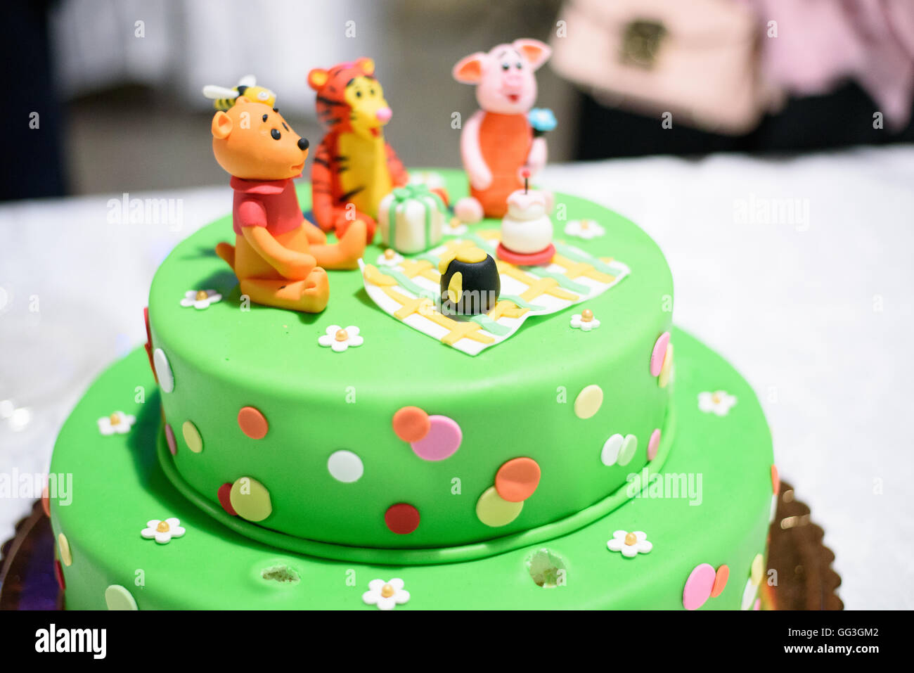 Birthday cake with candles and Winnie the Pooh by Disney Stock Photo