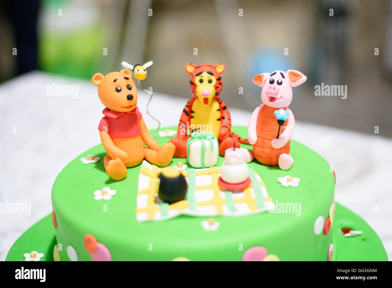 Birthday cake with candles and Winnie the Pooh by Disney Stock Photo