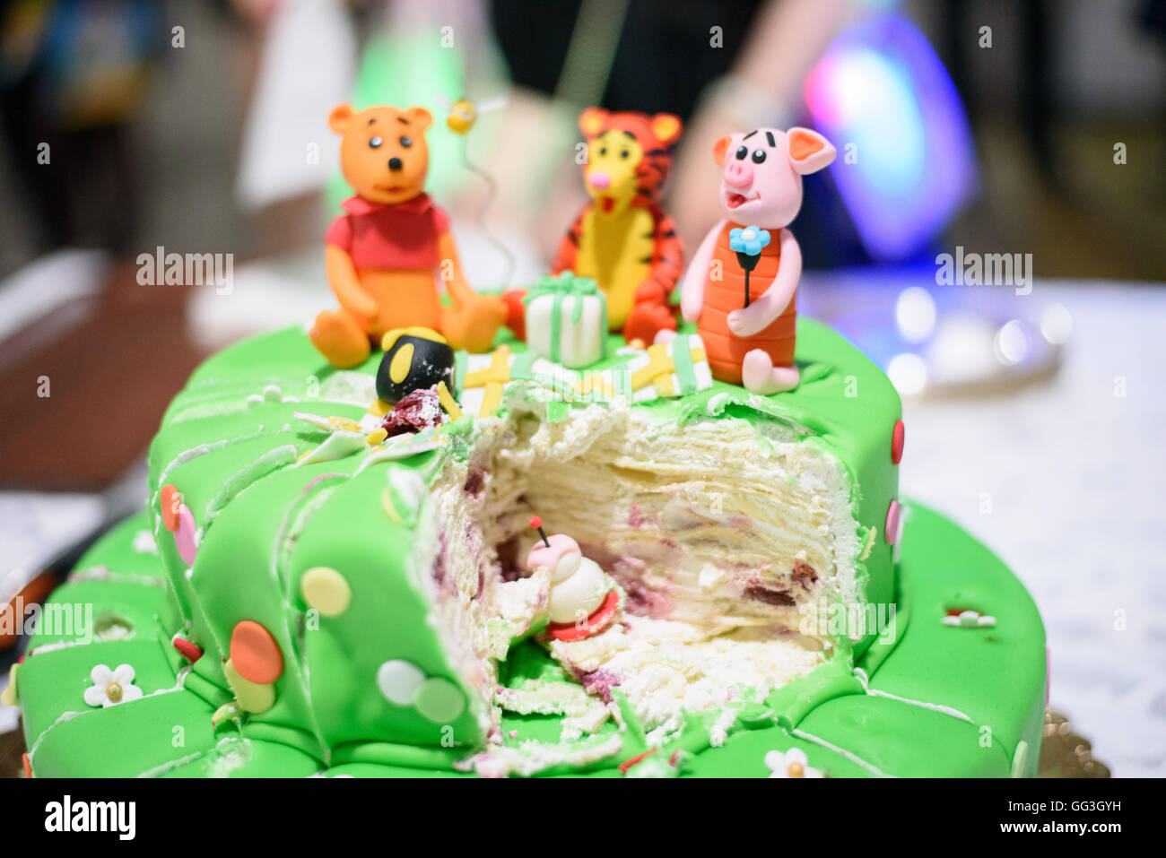 Birthday cake with candles and Winnie the Pooh by Disney Stock Photo
