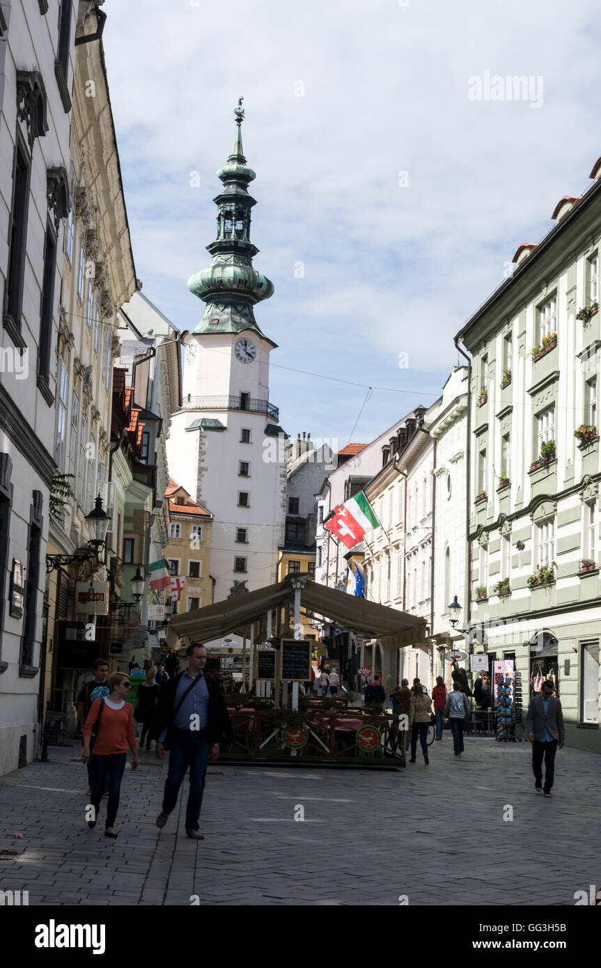 Michalska ulica  (Michalska Street) lined with open-air restaurants and St. Michael's Gate in Bratislava old town, Bratislava Stock Photo