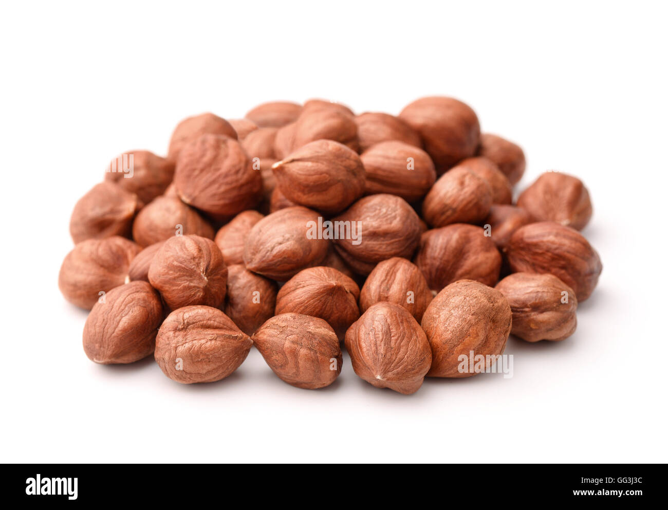 Pile of peeled hazelnuts isolated on white Stock Photo