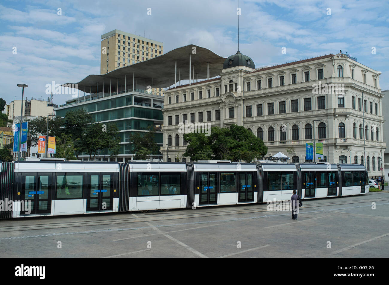Rio de Janeiro Light Rail ( Portuguese - VLT do Rio de Janeiro or VLT Carioca ), a light rail system opened in June 2016 ahead of the 2016 Olympic Games passes in front of Rio de Janeiro Art Museum ( Museu de Arte do Rio - MAR ) in Rio de Janeiro port surrounding area, Brazil, part of the Porto Maravilha Project ( Marvelous Port Program ), a revitalization project of the city Port Zone. Stock Photo