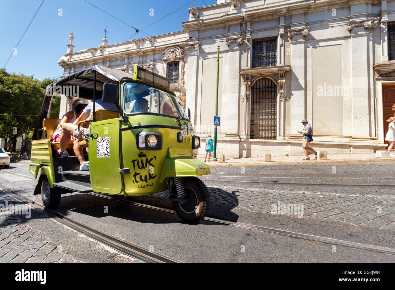 A Tuk Tuk driving along a street in Lisbon, Portugal Stock Photo
