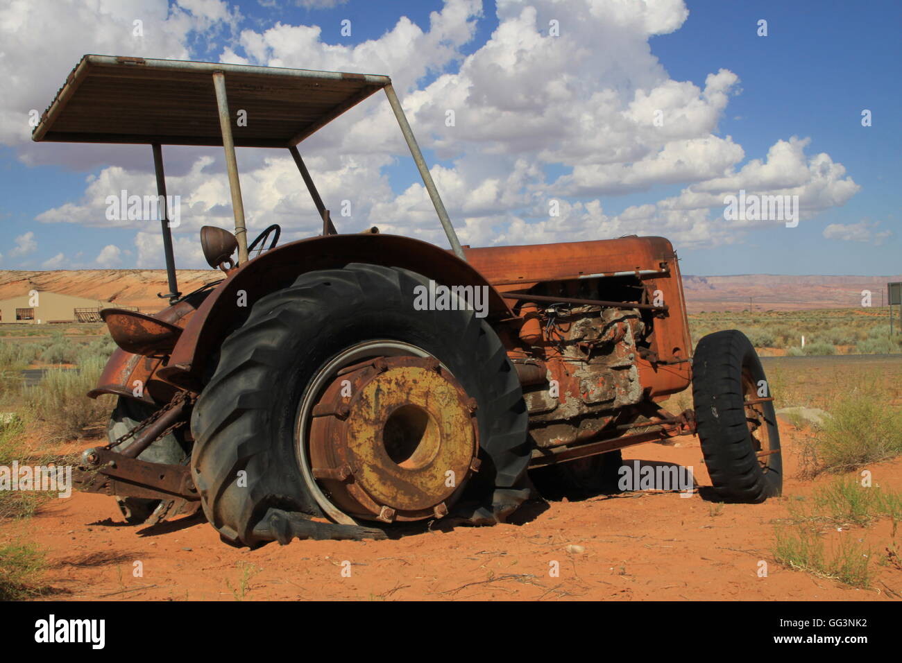 Abandoned farm tractor in desert Stock Photo