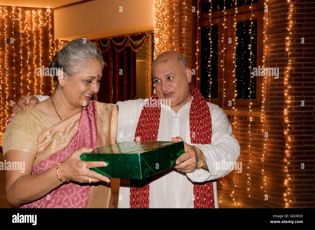 Presenting a Diwali gift Stock Photo