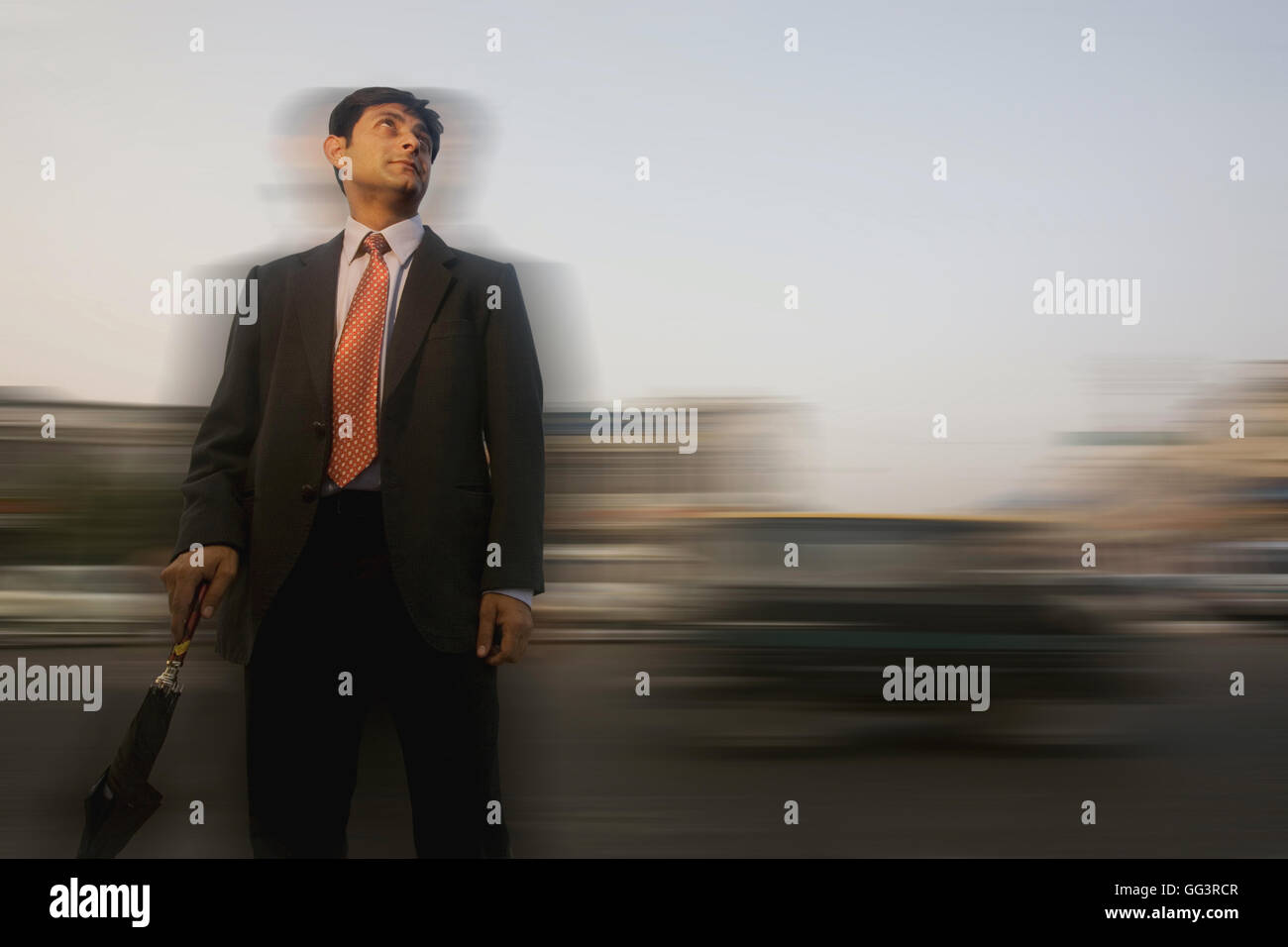 Man with umbrella Stock Photo - Alamy