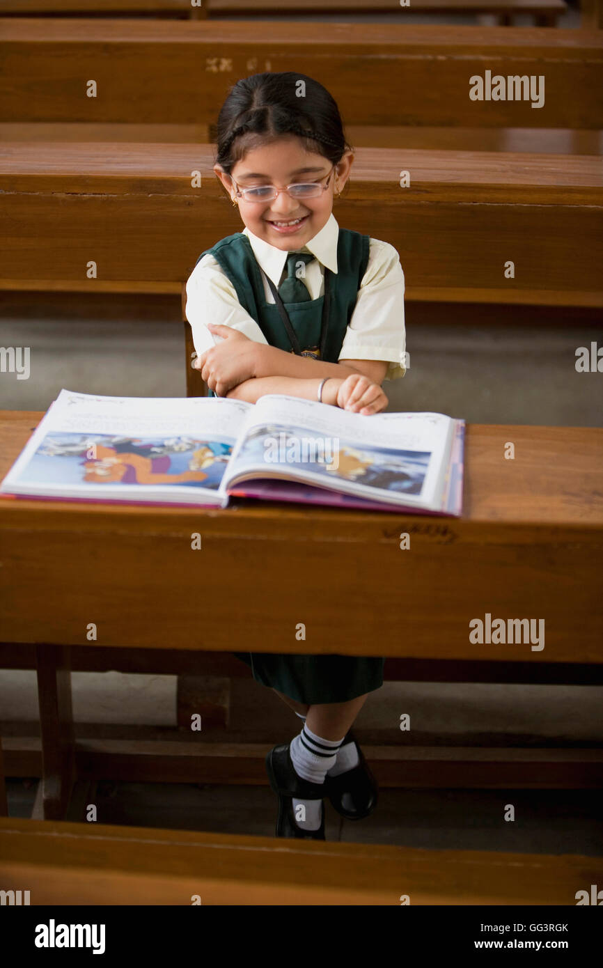 Indian school girls reading book hi-res stock photography and images ...