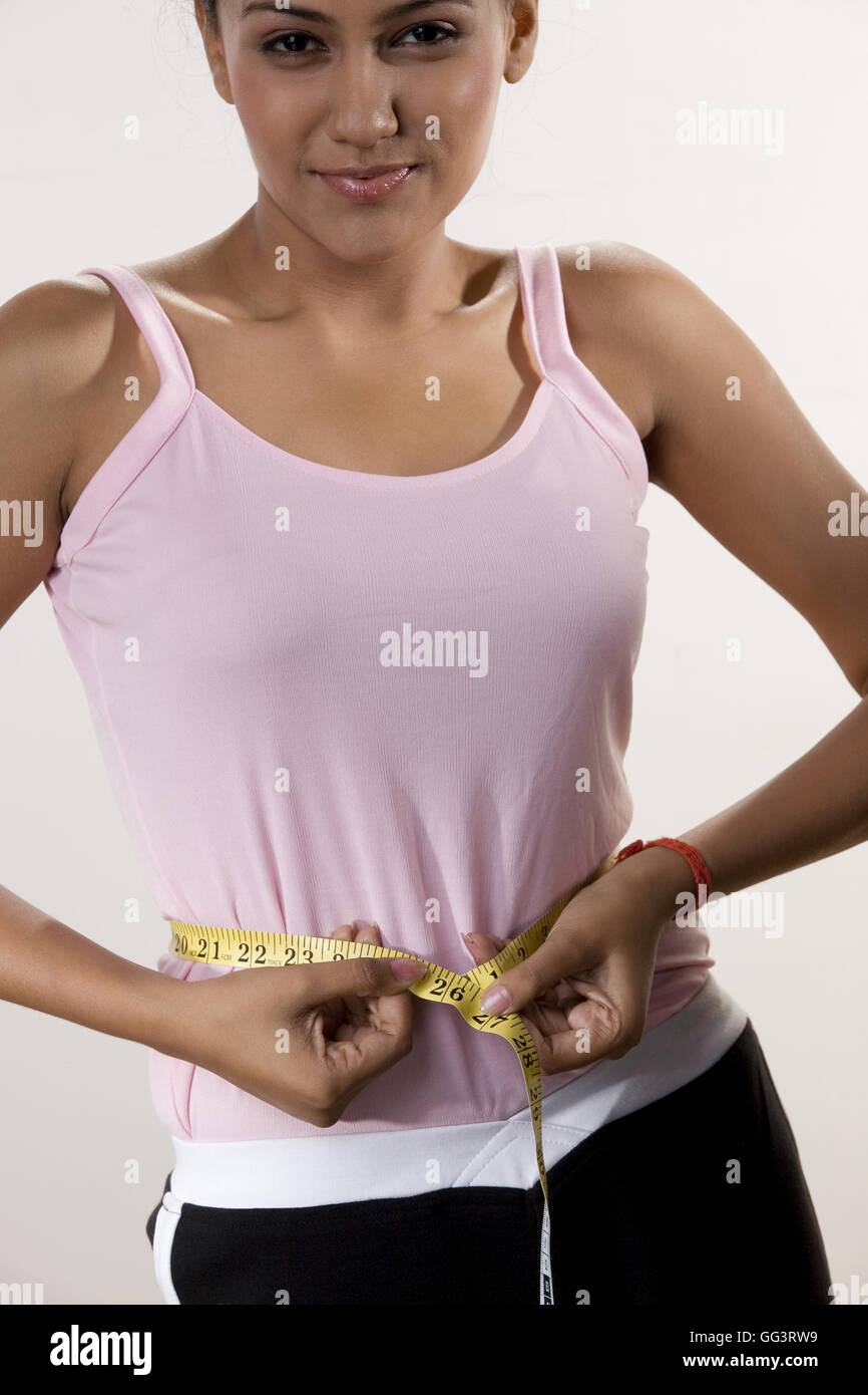 Woman with a tape measure Stock Photo