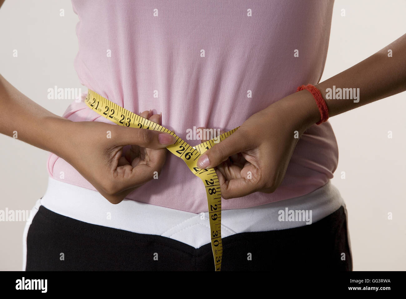 Woman with a tape measure Stock Photo