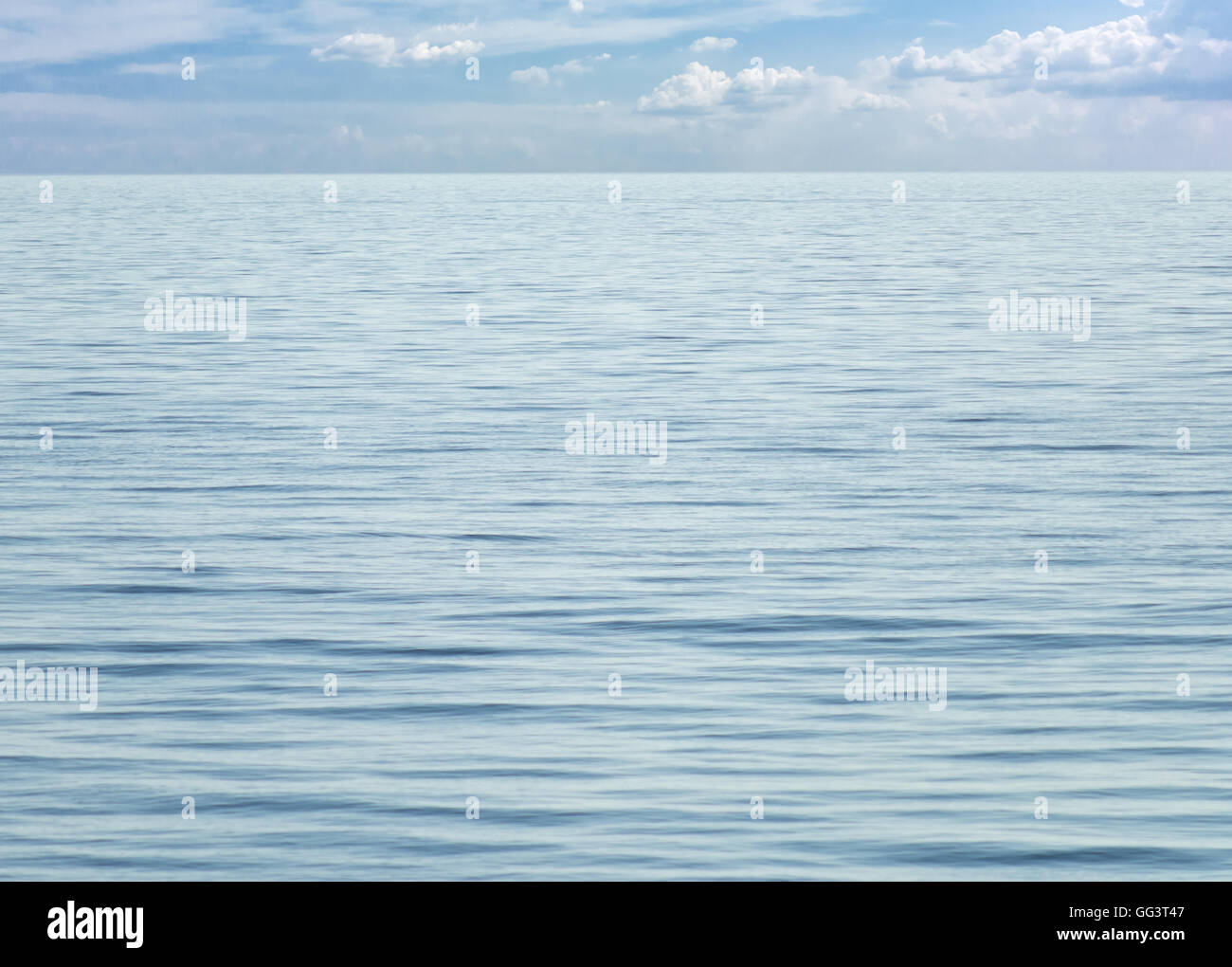 blue sea with cloudy sky Stock Photo - Alamy