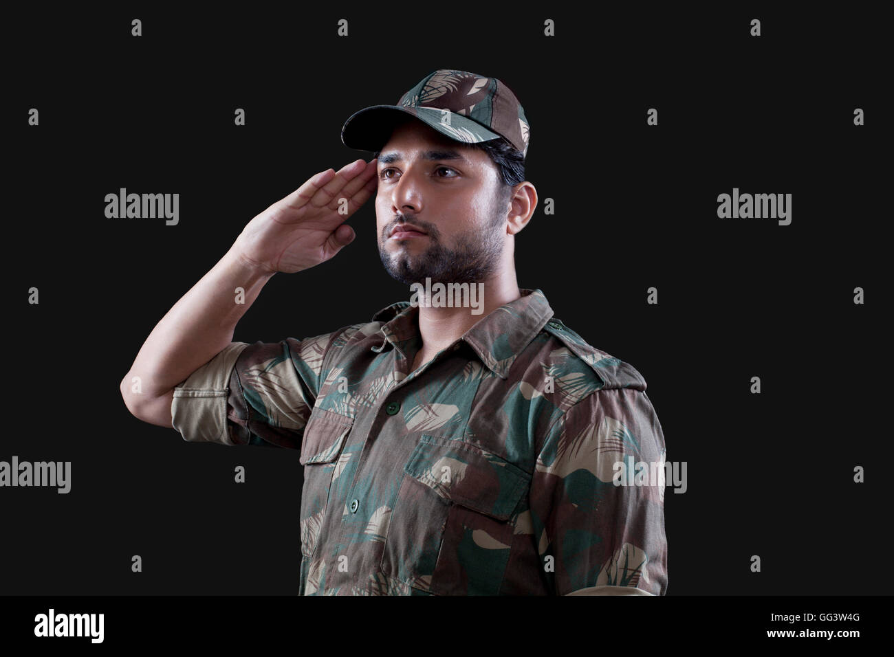 Young male soldier saluting Stock Photo - Alamy