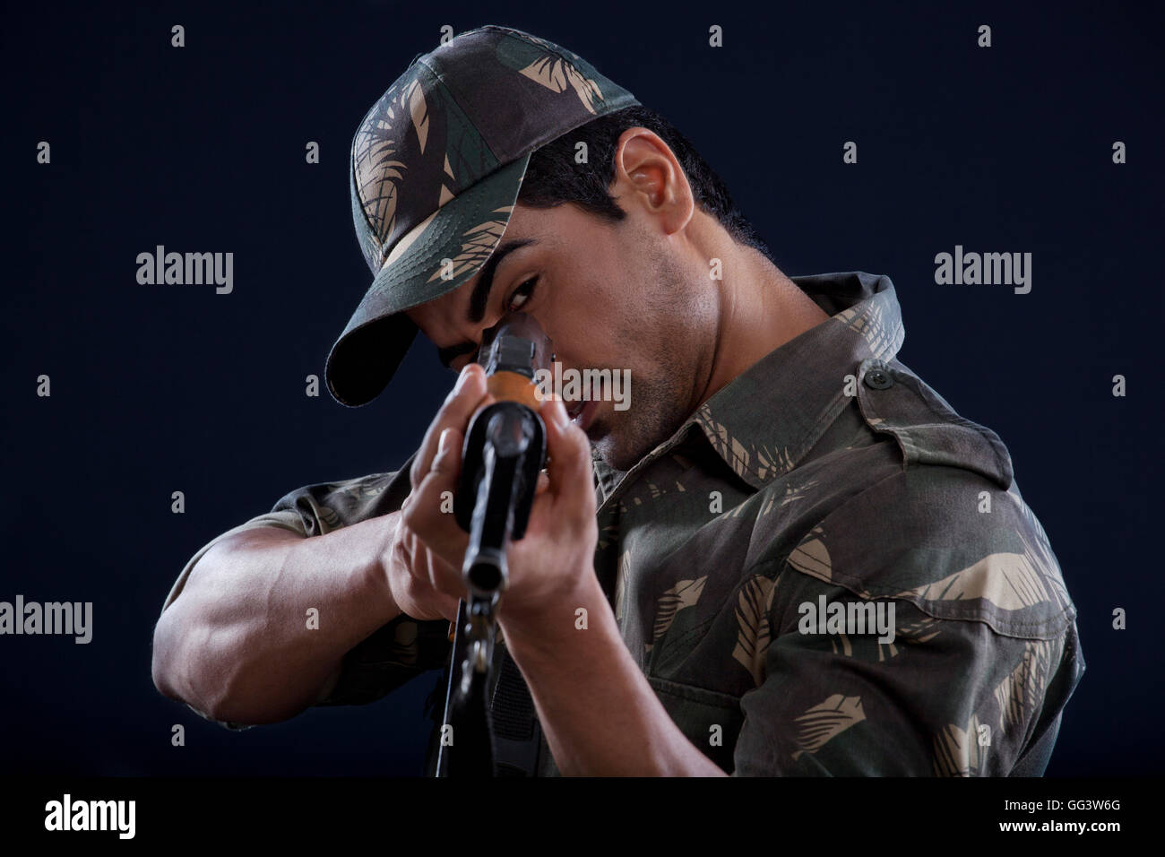 Young soldier aiming gun Stock Photo - Alamy
