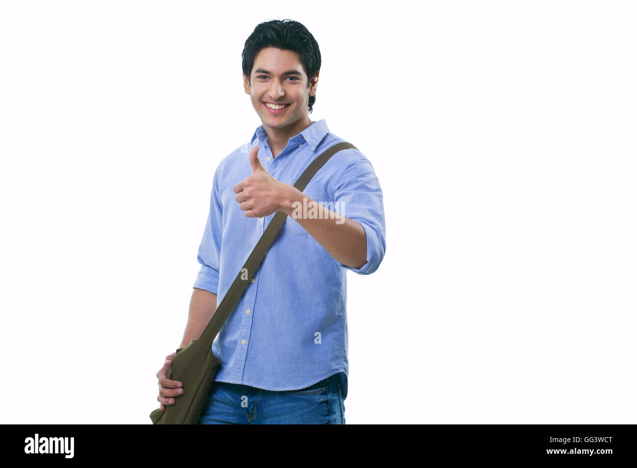 College student showing thumbs up sign Stock Photo - Alamy