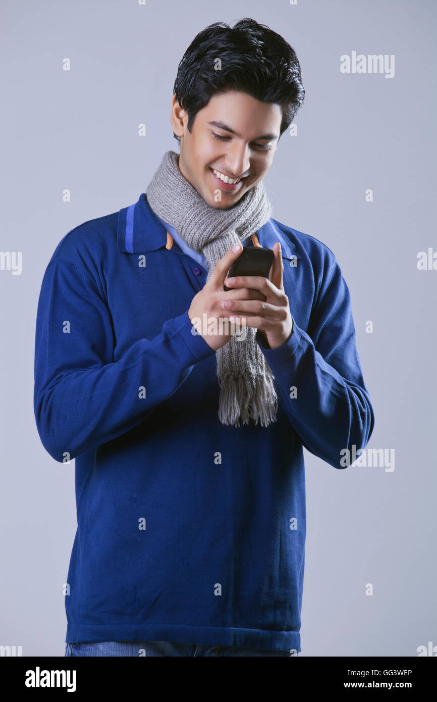 Young man reading text message Stock Photo