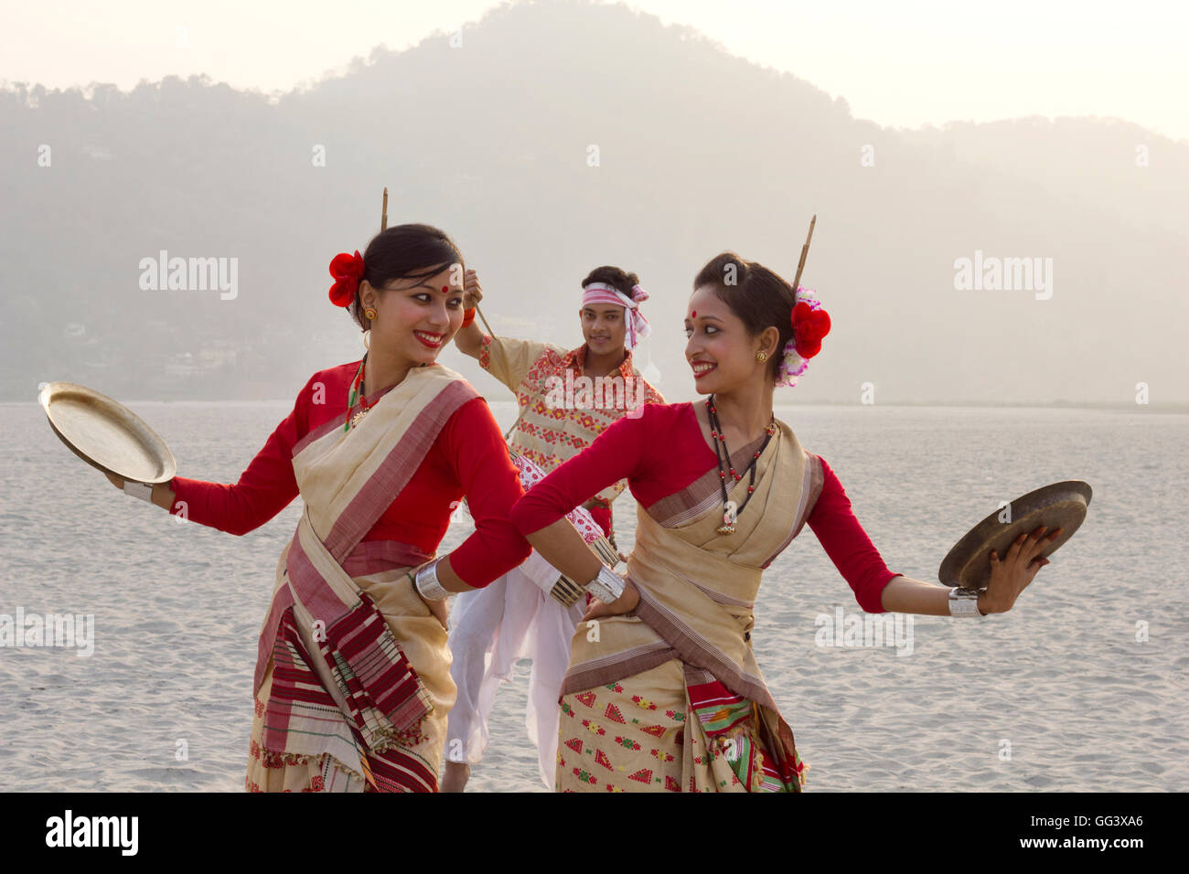 Bihu women dancing with brass plates Stock Photo Alamy
