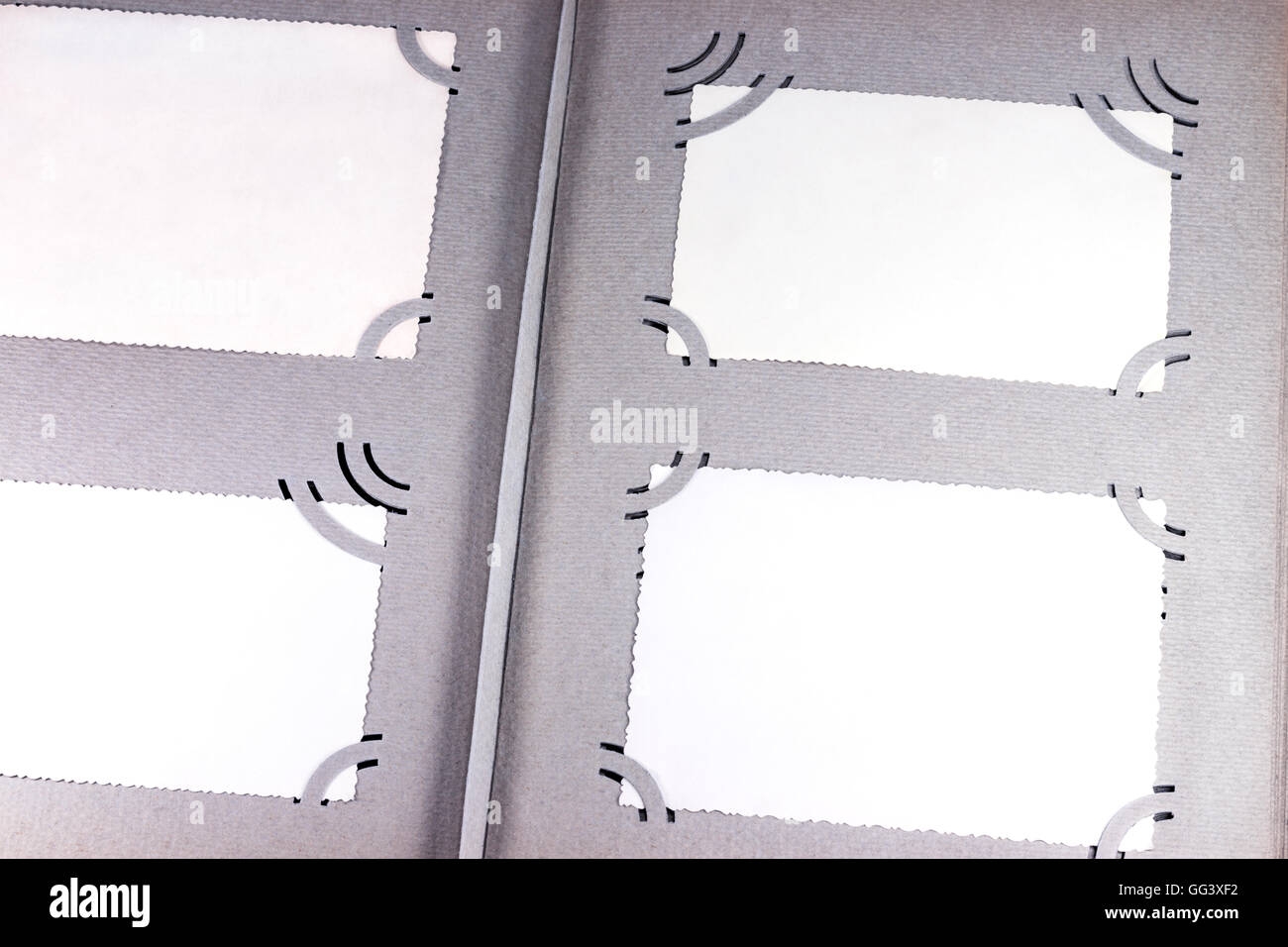 Blank photographs in an album page with retro corner holders Stock Photo Alamy