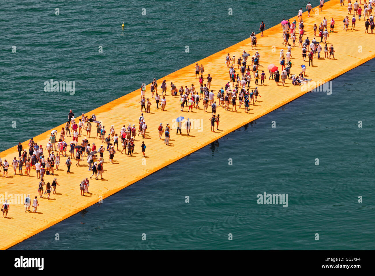 Floating Piers Project for Lake Iseo, Italy, by Christo and Jeanne-Claude. View from above of crowds on installation walkway. Stock Photo