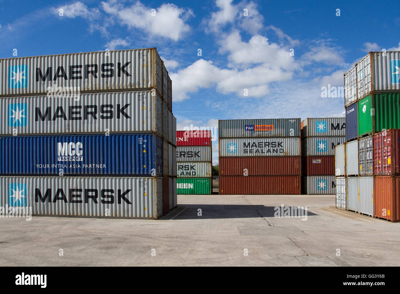 Cargo and shipping containers stacked high before being loaded onto freight trains for onward