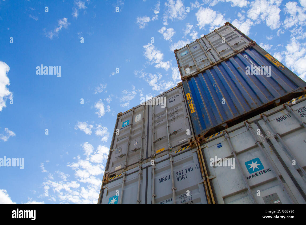 Cargo and shipping containers stacked high before being loaded onto freight trains for onward