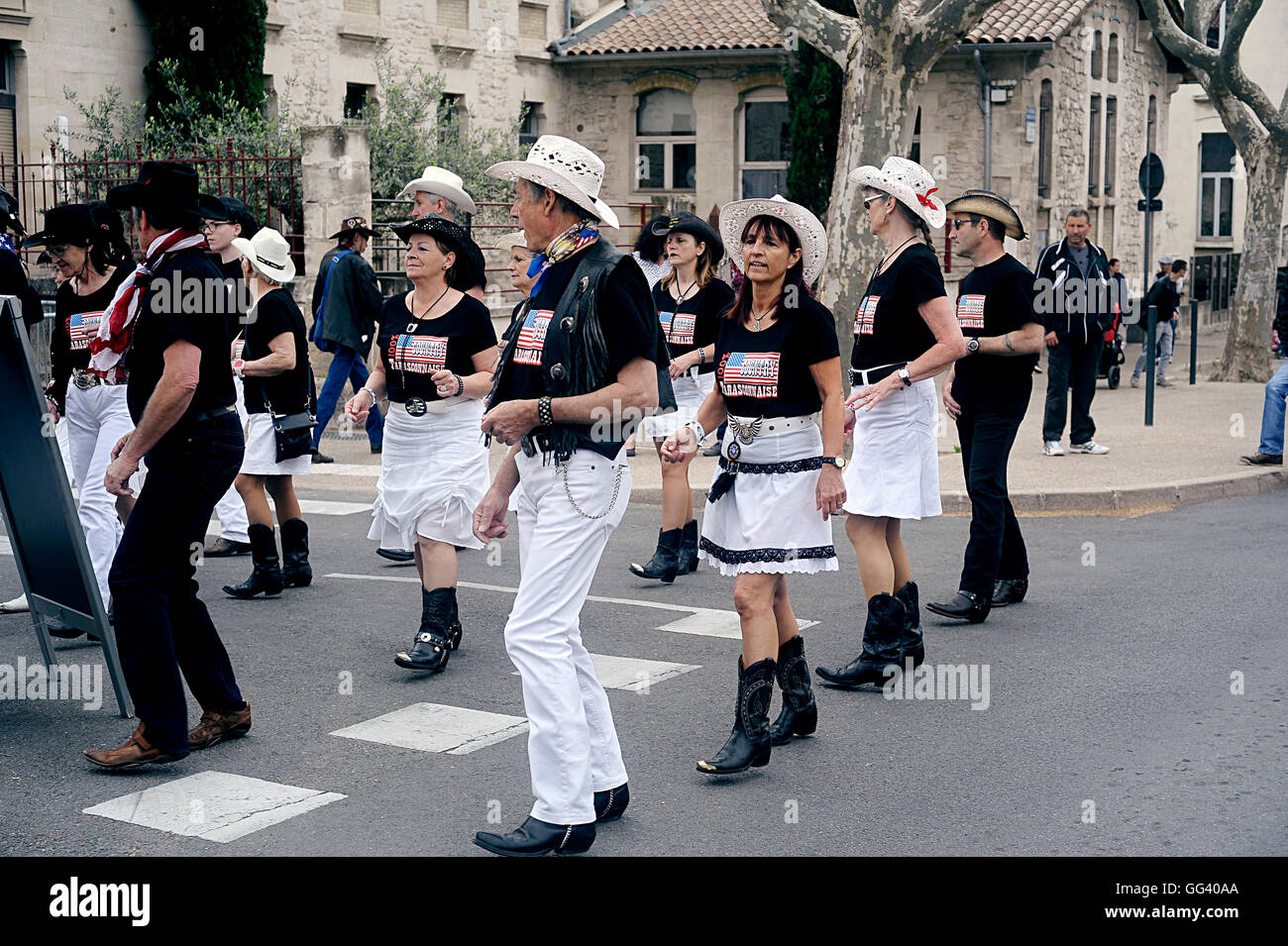Country dancers in full demonstration in a gathering of American motorcycle in the town of Beaucaire Stock Photo