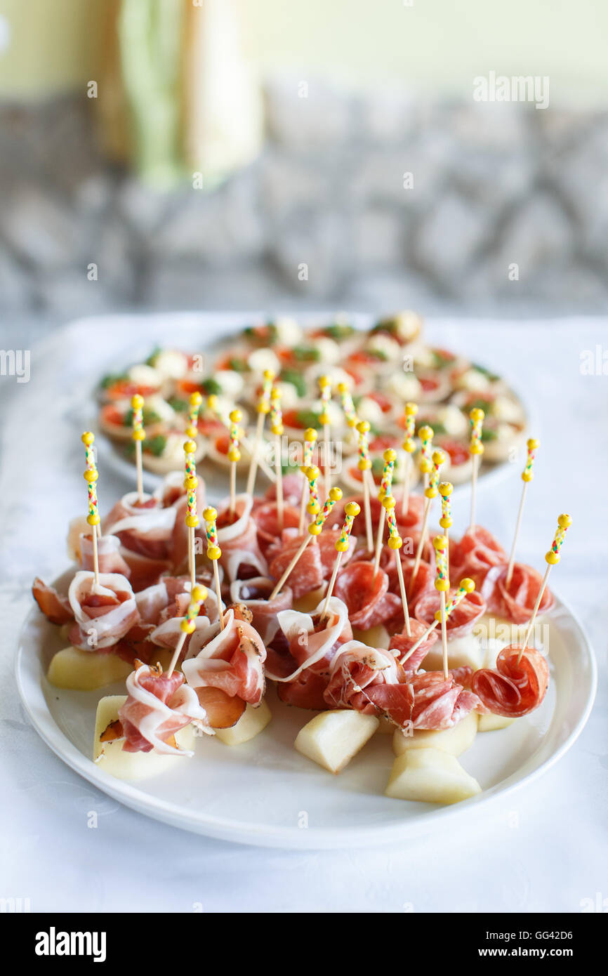 Italian prosciutto ,raw ham leg sliced on white plate Stock Photo Alamy