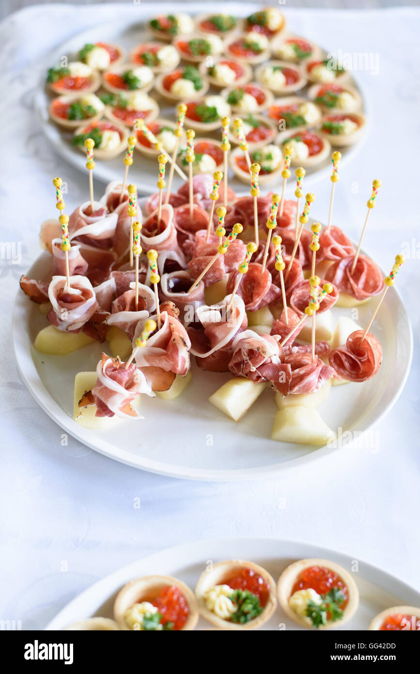 Italian prosciutto ,raw ham leg sliced on white plate Stock Photo Alamy