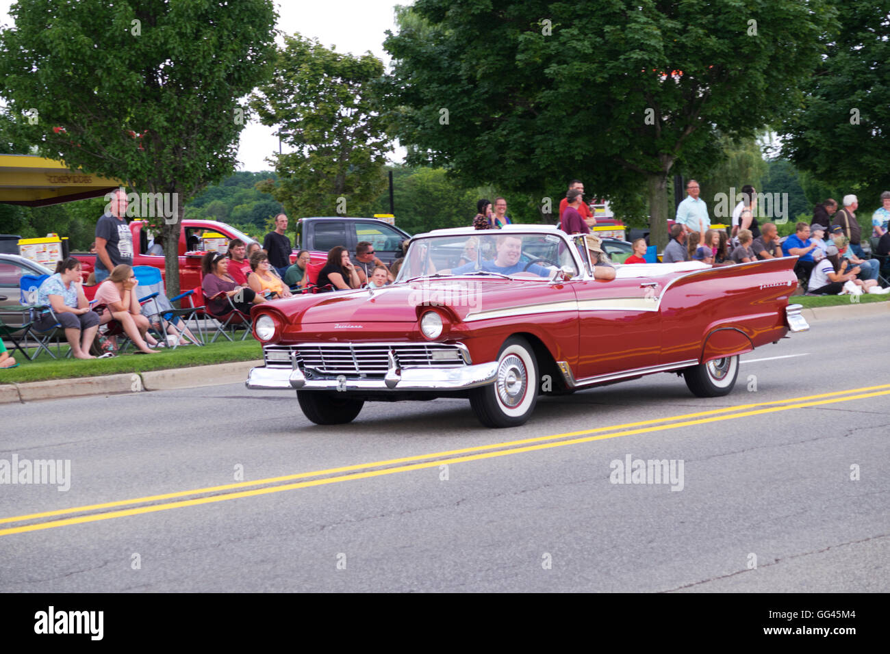 1957 Ford Fairlane convertible participates in 2016 Annual Cruz In parade through Whitehall and Montague, Michigan. Stock Photo