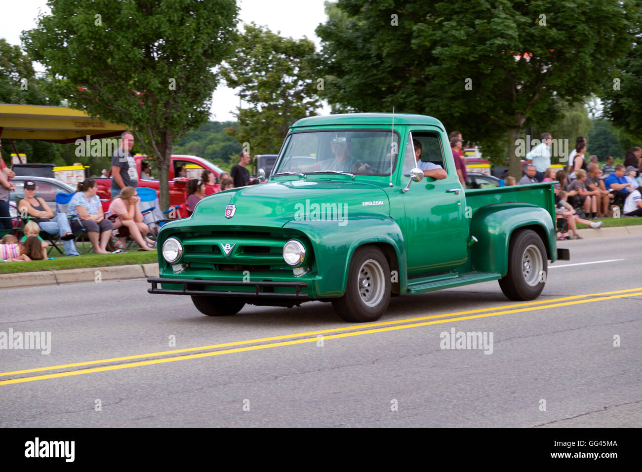 Early 1950s Ford 1500 pick up truck participating in the 2016 annual Cruz In parade for vintage and antique automobiles. Stock Photo