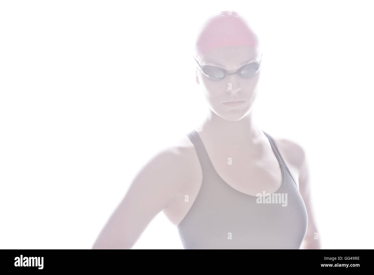 Artsy high key portrait of a female swimmer standing Stock Photo