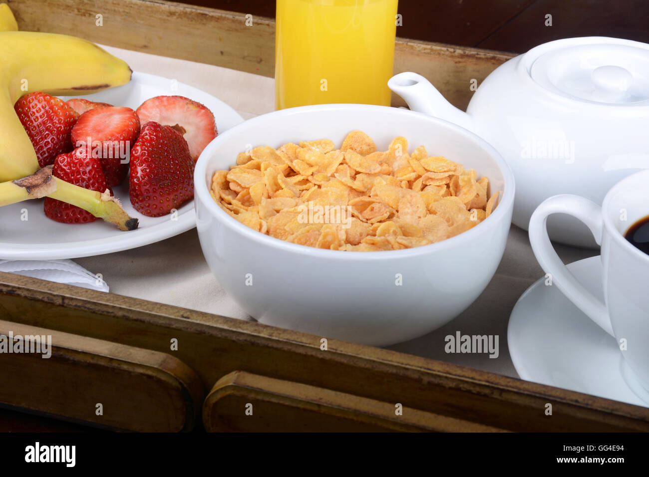 Breakfast tray with coffee, orange juice, cereals and fruits Stock