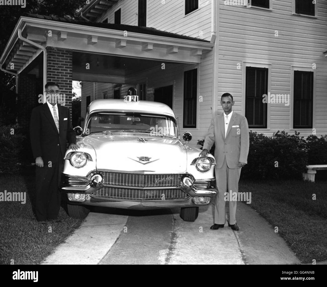 Funeral Home employees with hearse Quincy Stock Photo