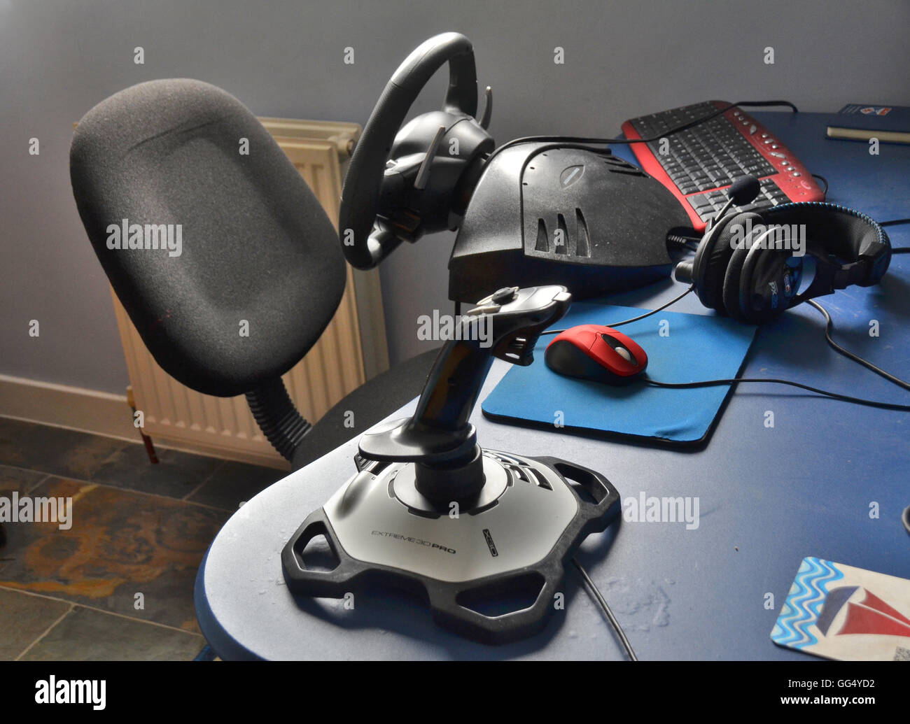 gaming rig, station, including accessories connected to the  PC,  such as joystick,headphones, mouse, keyboard  steering wheel. Stock Photo