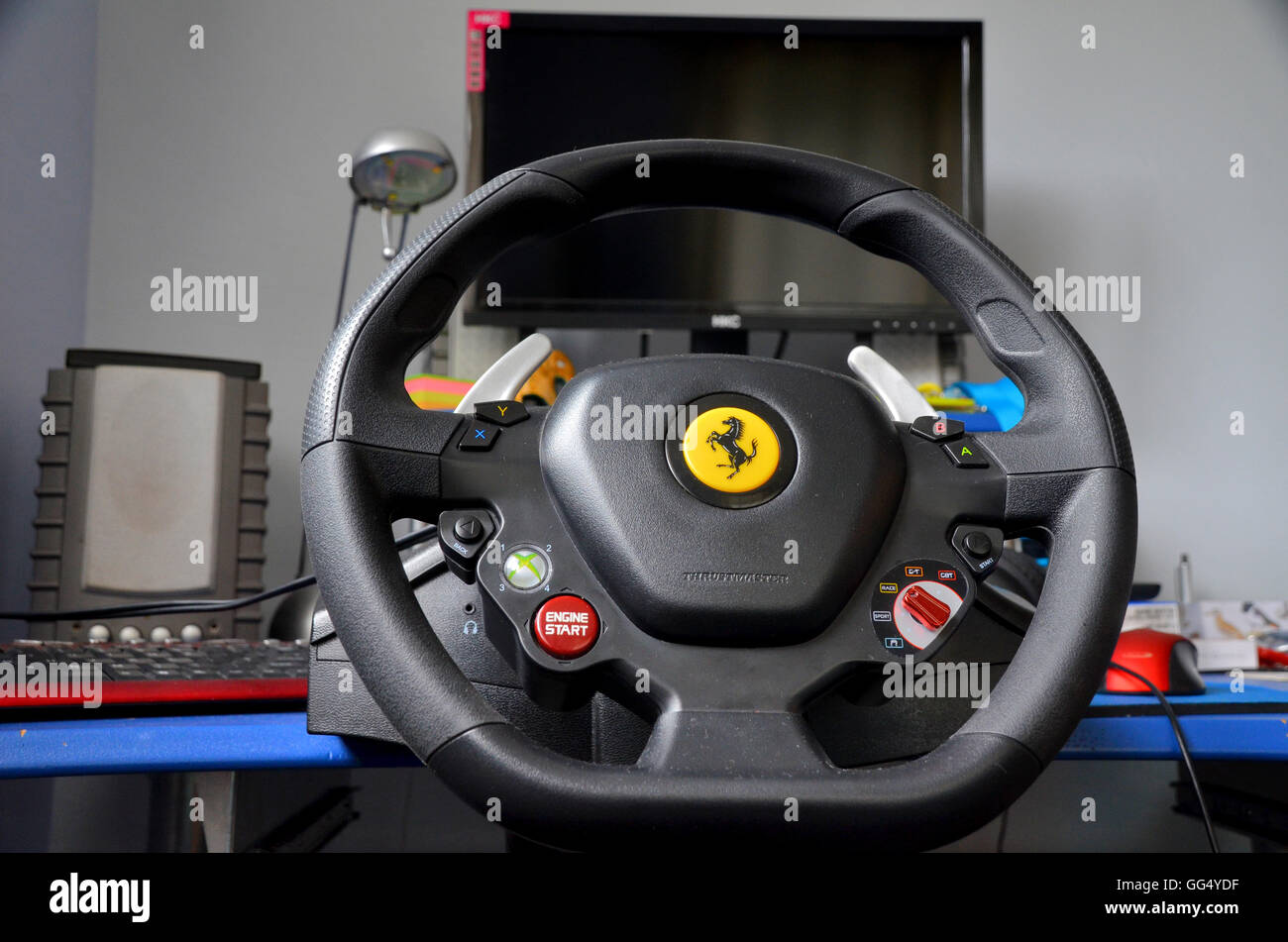 computer gaming rig - includes steering wheel assembled to desktop. monitor and speakers. Stock Photo