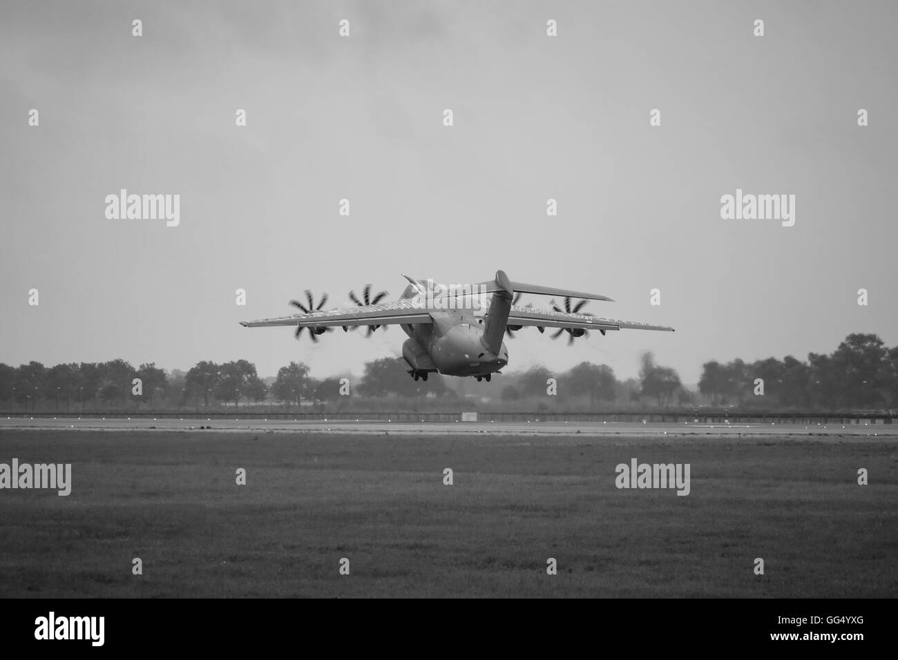 Demonstration flight at rainy day of the military transport aircraft Airbus A400M Atlas. Stock Photo