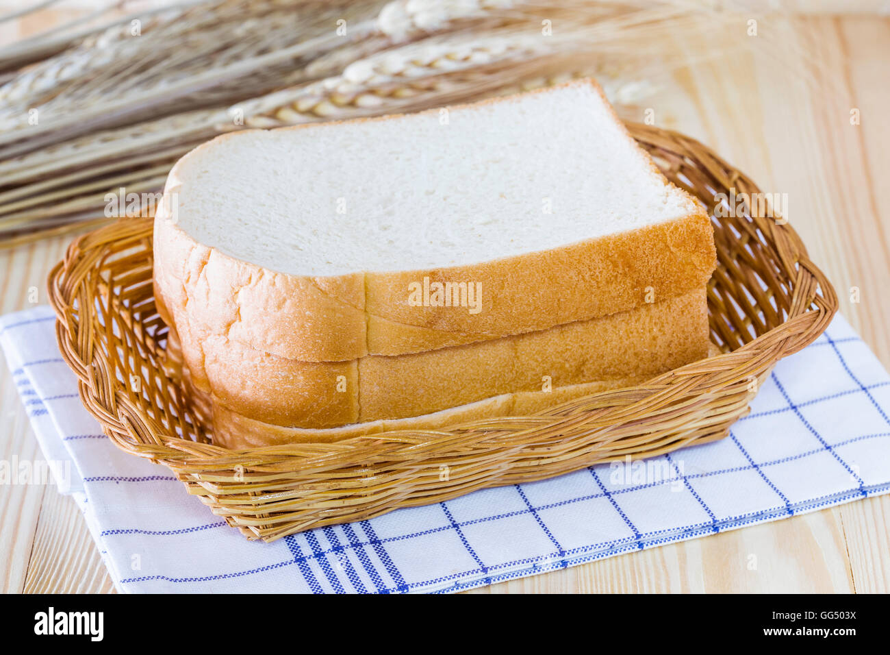 Put a slice of bread in the basket for eating Stock Photo Alamy