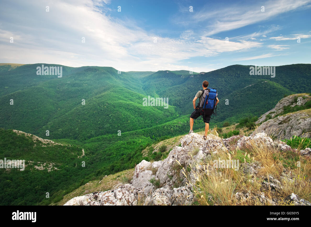 Man tourist in mountain. Nature and adventure composition. Stock Photo