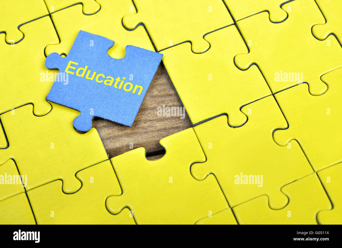 Puzzle pieces with word Education Stock Photo