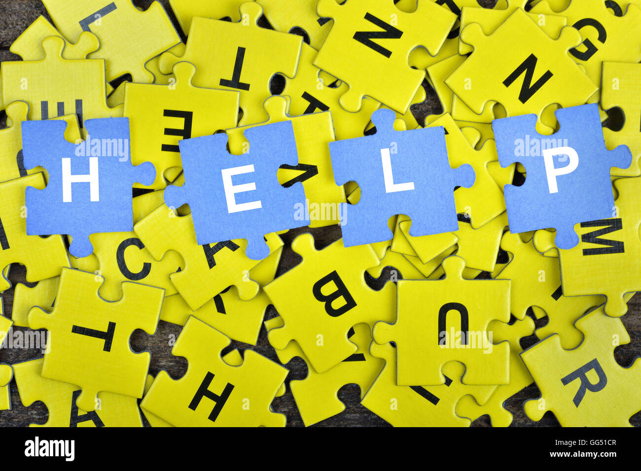 Puzzle pieces with word Help Stock Photo Alamy