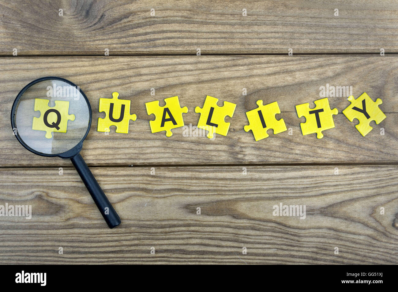 Puzzle pieces with word Quality Stock Photo - Alamy