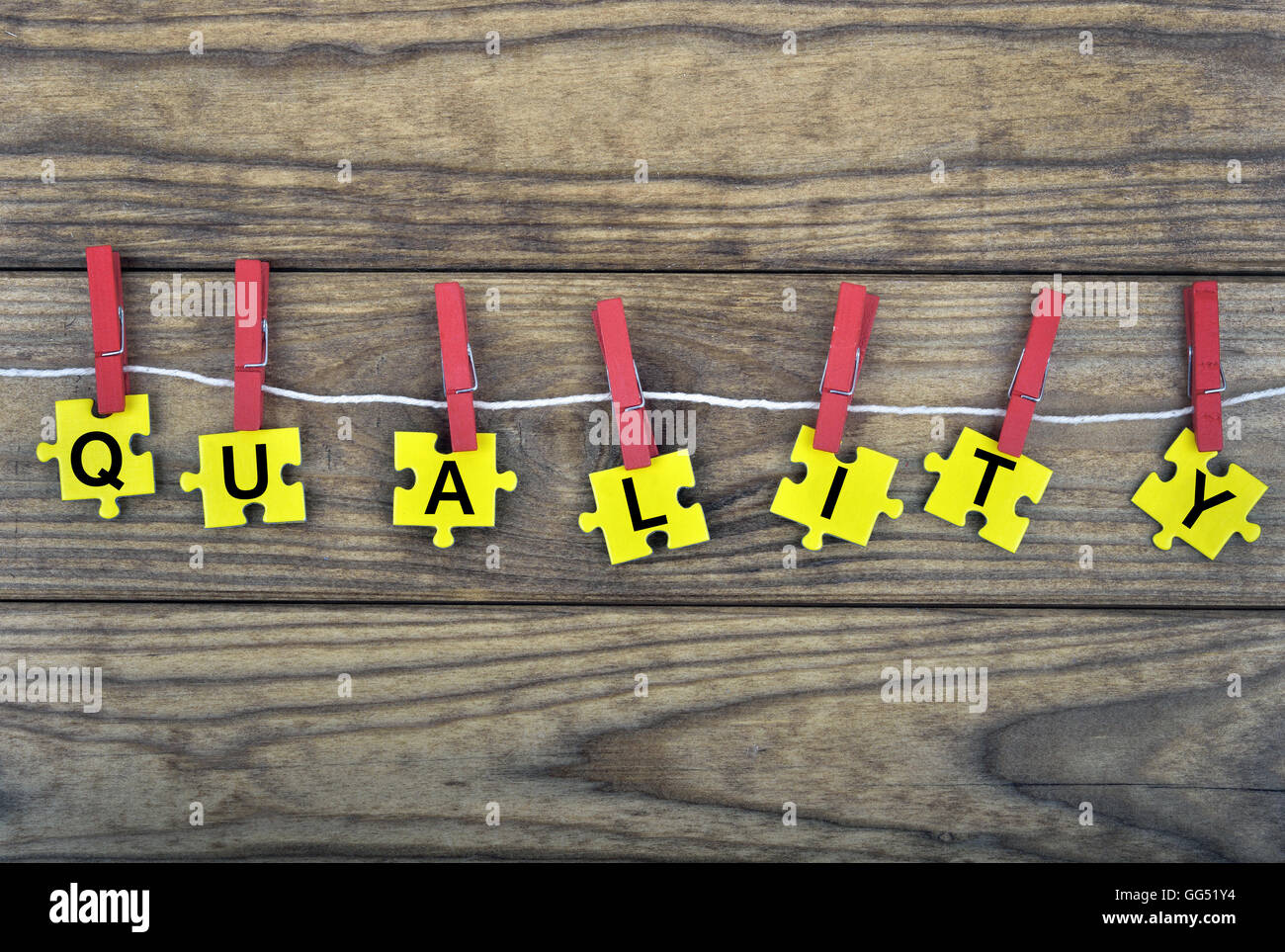 Puzzle pieces with word Quality Stock Photo - Alamy