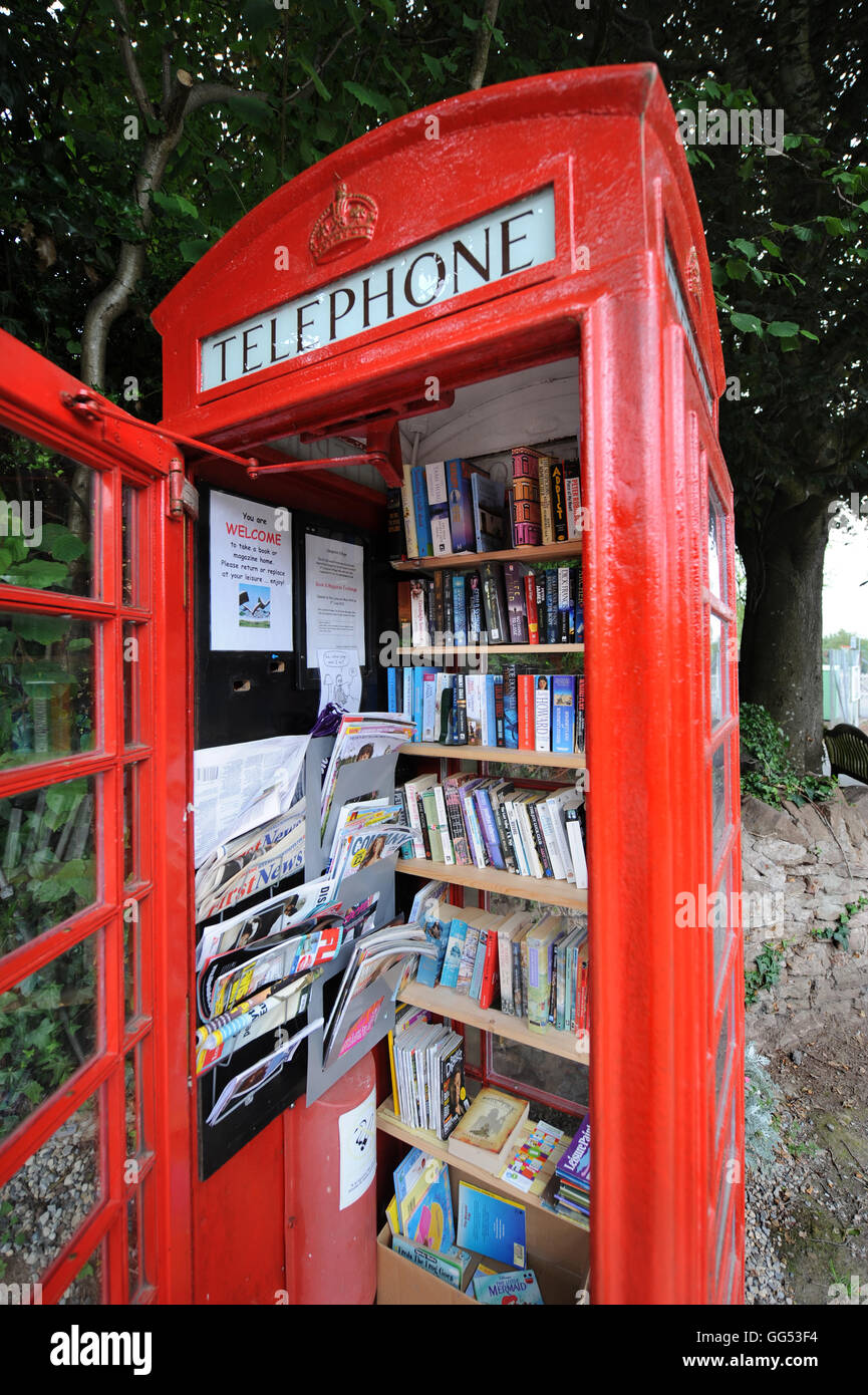 A disused telephone box used as a book exchange in the village of Llangrove in Herefordshire UK Stock Photo