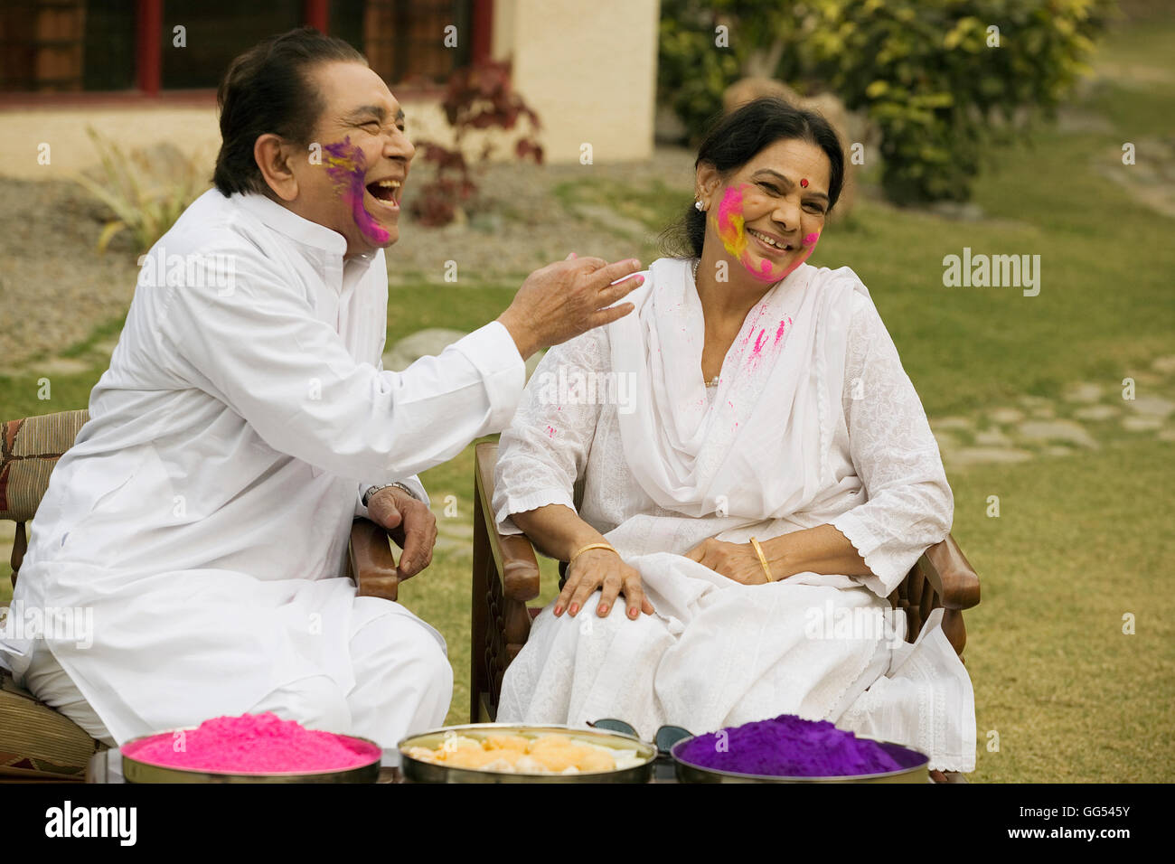 Couple celebrating Holi Stock Photo