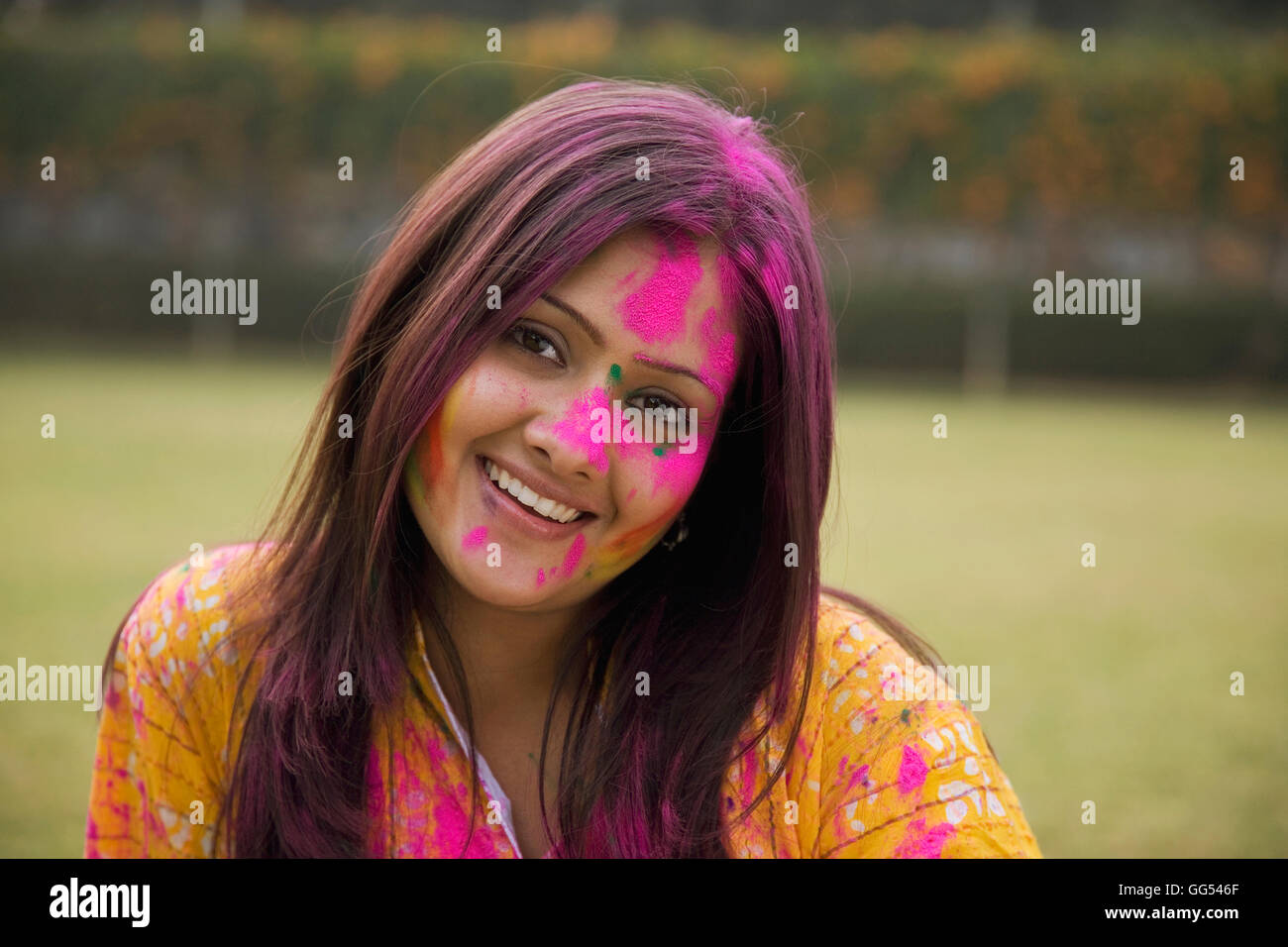 Womans face covered with gulal Stock Photo