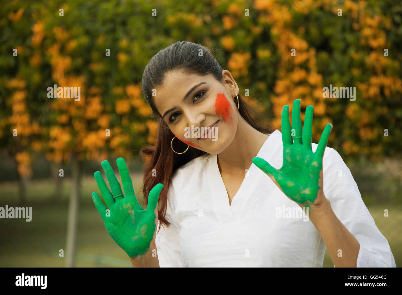 Woman playing Holi Stock Photo