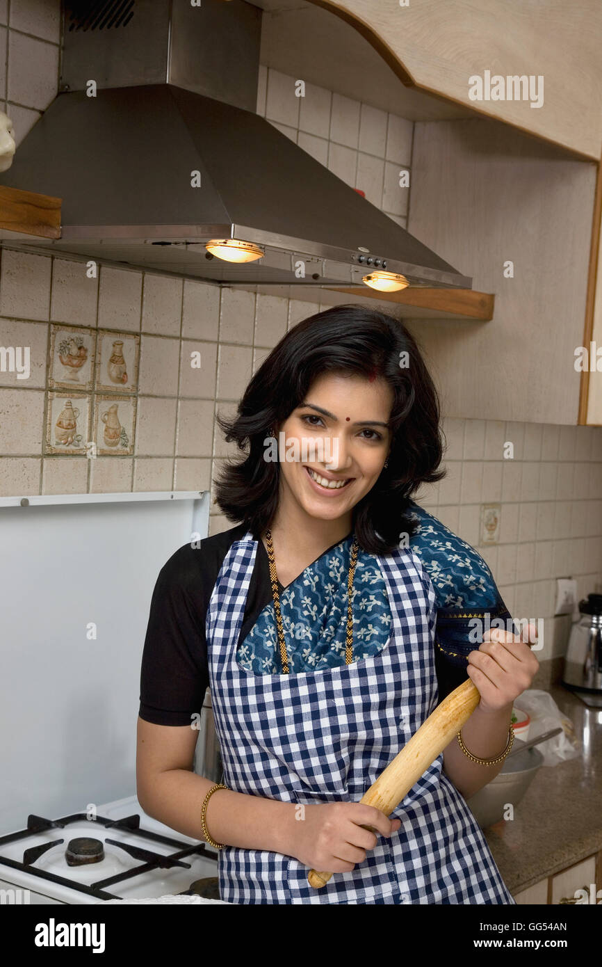 Portrait of a woman in a kitchen Stock Photo Alamy