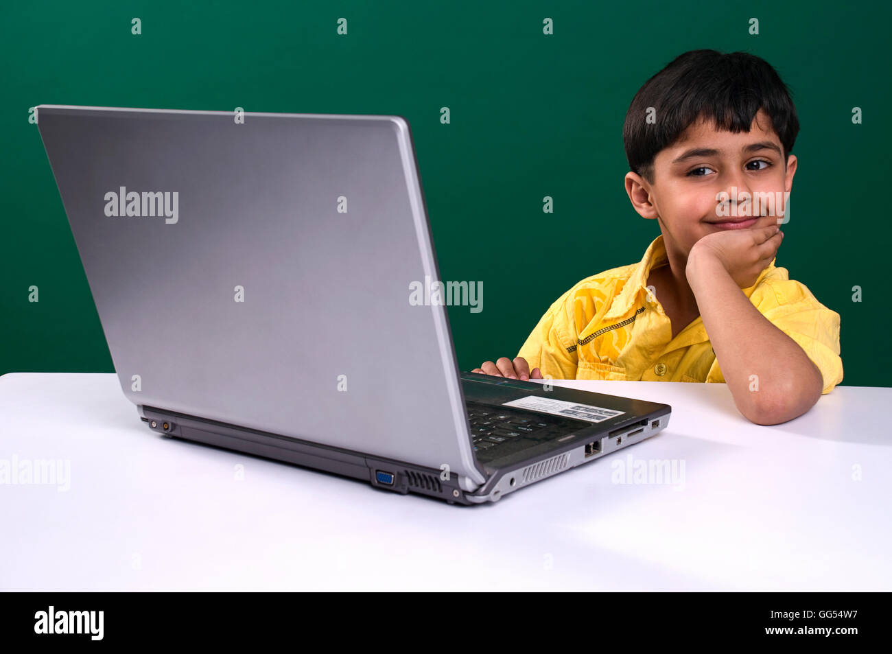 A boy with a laptop Stock Photo - Alamy