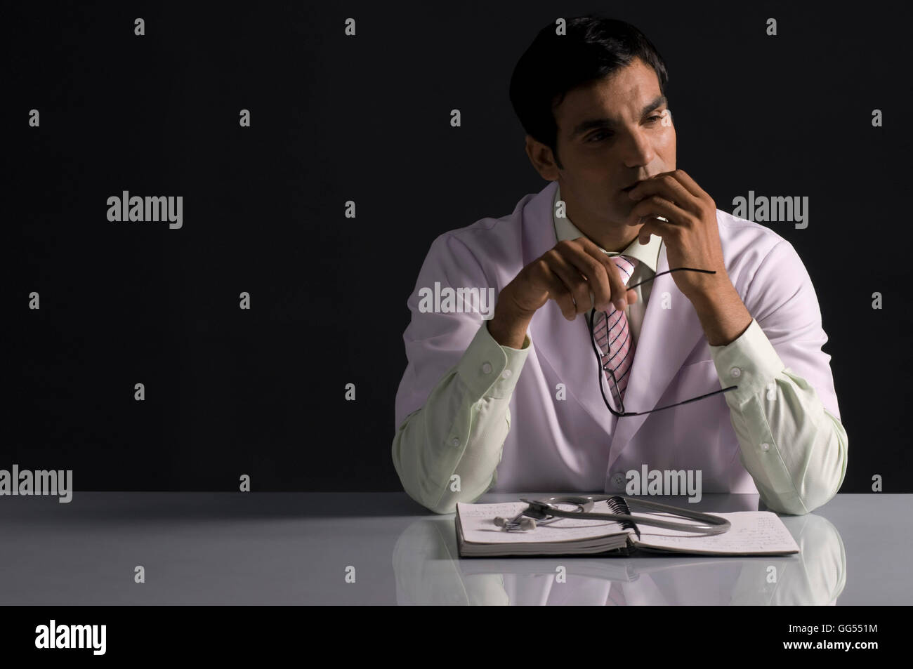 Indian male doctor book hi-res stock photography and images - Alamy